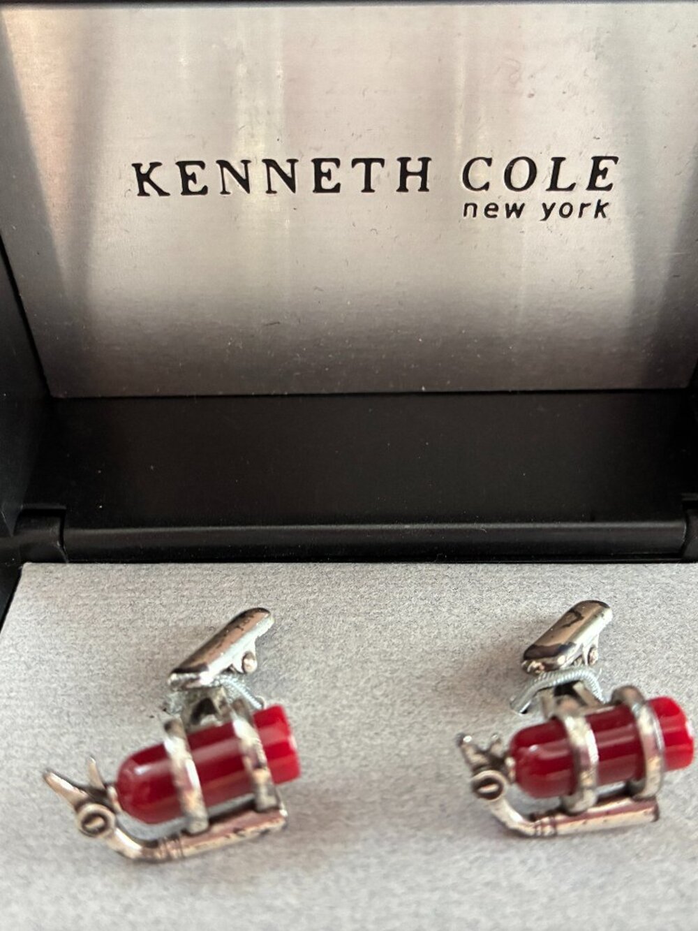 NEW. Kenneth Cole New York Silver Tone Red Enamel Fire Extinguisher Cuffs